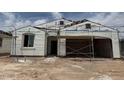 Under construction, this single-story home will feature a charming facade with a two-car garage at 24080 W Bowker St, Buckeye, AZ 85326