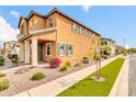 A view of a two-story house with stucco exterior and a strip of grass at 2708 S Santa Rita --, Mesa, AZ 85209