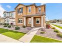 A charming home boasts a manicured lawn and inviting facade with well-kept landscaping at 2708 S Santa Rita --, Mesa, AZ 85209