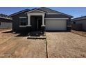 Charming single-story home featuring a two-car garage and a welcoming front entrance at 4329 E Brook Lynn Pl, San Tan Valley, AZ 85143