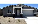 Charming single-story home featuring a gray exterior, well-kept landscaping, and an attached two-car garage at 4329 E Brook Lynn Pl, San Tan Valley, AZ 85143