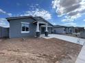 Street view of a cozy single-story home with a manicured lawn and covered entryway at 4329 E Brook Lynn Pl, San Tan Valley, AZ 85143
