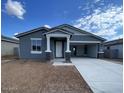 Charming single-story home featuring a welcoming porch and a two-car driveway at 4329 E Brook Lynn Pl, San Tan Valley, AZ 85143
