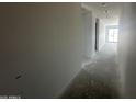 Bright hallway with modern recessed lighting, ready for personalization and finishing touches at 4329 E Brook Lynn Pl, San Tan Valley, AZ 85143