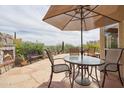 Relaxing outdoor patio with seating area, fireplace and views at 4903 S Desert Willow Dr, Gold Canyon, AZ 85118