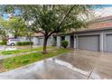 Charming townhome with two-car garage, tile roof, and mature landscaping at 7401 W Arrowhead Clubhouse Dr # 1006, Glendale, AZ 85308