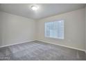 Bright bedroom with a large window, providing natural light and a view at 1920 E Bell Rd # 1006, Phoenix, AZ 85022