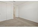 Empty bedroom with carpet, closet, and white walls at 3485 E Audrey Dr, San Tan Valley, AZ 85143