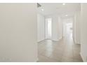Bright hallway features neutral tile flooring and white walls at 3485 E Audrey Dr, San Tan Valley, AZ 85143