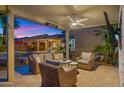 Relaxing covered patio featuring stylish wicker furniture, perfect for entertaining and enjoying the backyard view at 3953 E Lafayette Ave, Gilbert, AZ 85298