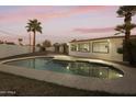 Backyard pool with new patio and updated home exterior featuring palm trees at 4410 N 20Th Ave, Phoenix, AZ 85015