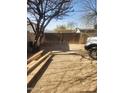 Backyard with gravel, a wooden fence, and a portion of the house at 4610 W Indianola Ave, Phoenix, AZ 85031