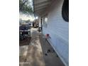 A view of the white brick exterior showing the side of the home at 4610 W Indianola Ave, Phoenix, AZ 85031