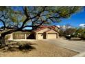 Spacious three-car garage and long driveway, providing plenty of parking space at 4750 W Saddlehorn Rd, Phoenix, AZ 85083