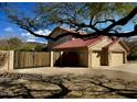 Three-car garage with a private gate offering ample parking and security at 4750 W Saddlehorn Rd, Phoenix, AZ 85083