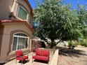 Cozy outdoor patio seating area next to the house at 4750 W Saddlehorn Rd, Phoenix, AZ 85083