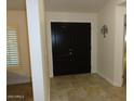 Welcoming entryway with tile flooring and elegant double doors, creating a great first impression at 6242 E Hearn Rd, Scottsdale, AZ 85254