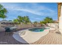 Private backyard with hardscape and pool area, ideal for outdoor gatherings at 6439 W Adobe Dr, Glendale, AZ 85308