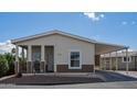 Inviting single-story home featuring a well-maintained exterior and covered parking area at 11596 W Sierra Dawn Blvd # 293, Surprise, AZ 85378