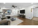 Bright and airy living room with hardwood floors, recessed lighting and large windows at 17234 N Paradise Park Dr, Phoenix, AZ 85032