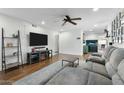 Open-concept living room with TV and comfortable seating at 17234 N Paradise Park Dr, Phoenix, AZ 85032