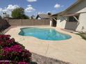 Refreshing pool with beautiful landscaping and sunny skies perfect for outdoor enjoyment at 2223 W 8Th Ave, Mesa, AZ 85202