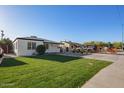 Beautiful house featuring a green lawn and a driveway leading to the front of the home at 2938 N 15Th Ave, Phoenix, AZ 85015
