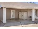 Attached carport featuring a secure storage shed, sheltered parking, and easy access to the home's entrance at 3243 E Forge Ave, Mesa, AZ 85204