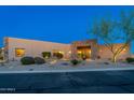 Desert home features a front yard with xeriscaping and a stone accent entry at 37015 N 27Th Pl, Cave Creek, AZ 85331