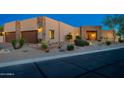 Charming home featuring a stone accent exterior and xeriscaping in a desert landscape at 37015 N 27Th Pl, Cave Creek, AZ 85331