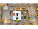 Aerial view of home with pool, patio, desert landscaping, and solar panels on the roof at 40108 N 2Nd Way, Phoenix, AZ 85086