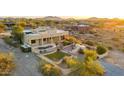 Aerial of home showing pool, patio, desert landscaping, and mountain view at 40108 N 2Nd Way, Phoenix, AZ 85086