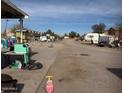 Outdoor lot filled with a collection of various items, including toys and equipment, suggesting outdoor recreation space at 502 E Roeser Rd, Phoenix, AZ 85040