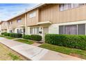 Beautiful townhome exterior showcasing well-manicured landscaping and a neat walkway at 5339 N Black Canyon Hwy, Phoenix, AZ 85015
