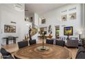 Spacious living and dining area with an elegant staircase and soaring ceilings at 6522 N 27Th St, Phoenix, AZ 85016