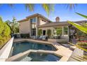 Backyard pool with inviting patio and lounge area in a private setting at 6522 N 27Th St, Phoenix, AZ 85016