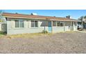Single-story home with a neutral exterior, offering a cozy and welcoming curb appeal at 701 N 95Th Cir, Mesa, AZ 85207