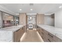 Bright kitchen features marble countertops, stainless steel appliances, sleek wood cabinets, and recessed lighting at 7157 E Rancho Vista Dr # 3001, Scottsdale, AZ 85251
