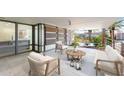 Outdoor patio with modern furniture, decorative landscaping, and privacy screens, perfect for relaxation at 7157 E Rancho Vista Dr # 3001, Scottsdale, AZ 85251
