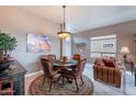 Comfortable dining room area with stylish furniture and decor, perfect for Gathering meals and entertaining at 7380 E Canyon Wren Dr, Gold Canyon, AZ 85118