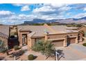 Inviting single-story home with desert landscaping and mountain views in a serene desert setting at 7380 E Canyon Wren Dr, Gold Canyon, AZ 85118