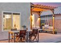 Backyard with a lounge area and patio furniture under a pergola, perfect for outdoor entertainment at 741 N Cholla St, Chandler, AZ 85224