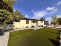 Inviting home with a well-manicured front yard and beautiful desert landscaping at 817 N 95Th Pl, Mesa, AZ 85207