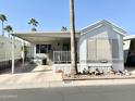 Inviting single-story home showcasing desert landscaping and a covered porch at 1027 S Prospector Dr, Apache Junction, AZ 85119