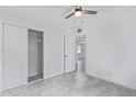 Clean and bright bedroom features neutral colors, tiled floor, and a closet with sliding doors at 2301 W Montebello Ave, Phoenix, AZ 85015