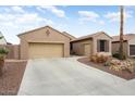 Beautiful home featuring a spacious driveway and front yard, offering convenient parking and curb appeal at 3327 N 163Rd Dr, Goodyear, AZ 85395