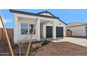 Modern single-Gathering home with a spacious two-car garage and tidy desert landscaping at 3889 S 233Rd Ln, Buckeye, AZ 85326