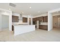 Open-concept kitchen with modern appliances, a large island, and ample cabinet space at 40129 N Alameda Dr, San Tan Valley, AZ 85140