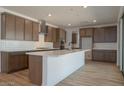 Spacious kitchen with stainless steel appliances, a large island, and modern cabinetry at 40147 N Alameda Dr, San Tan Valley, AZ 85140