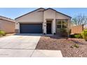 Inviting single-Gathering home with a well-maintained yard and a convenient two-car garage at 5101 E Sharbel Rd, San Tan Valley, AZ 85143